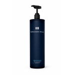 Vitalisierendes BRICKYARD 500 Superfresh Shampoo von GRAHAM HILL in einer dunkelblauen 1000-ml-Pumpflasche mit schwarzem Spender