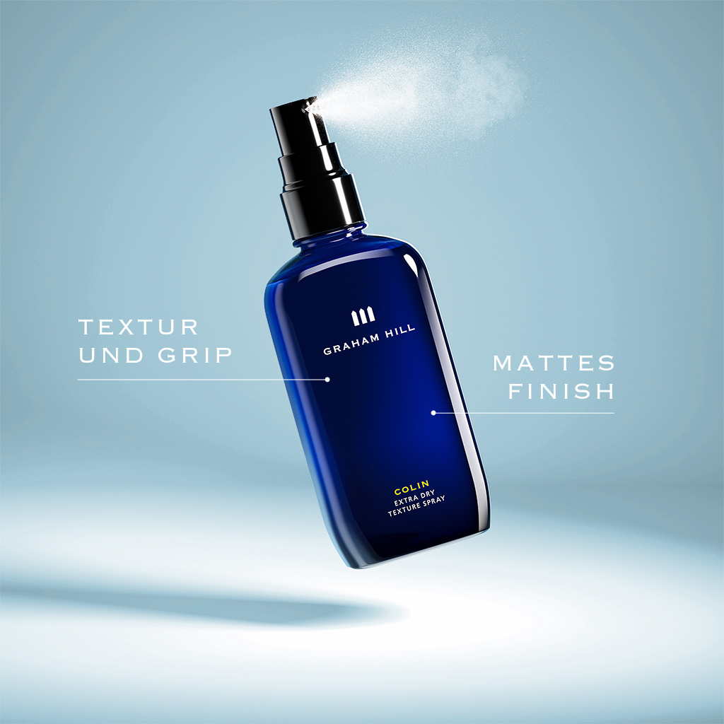 Sprühende Flasche des GRAHAM HILL COLIN Extra Dry Texture Spray mit den Hinweisen Textur und Grip sowie mattes Finish